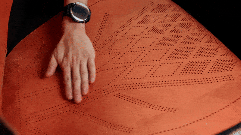 VeilFit™ Suede changing shade as a hand brushes the suede